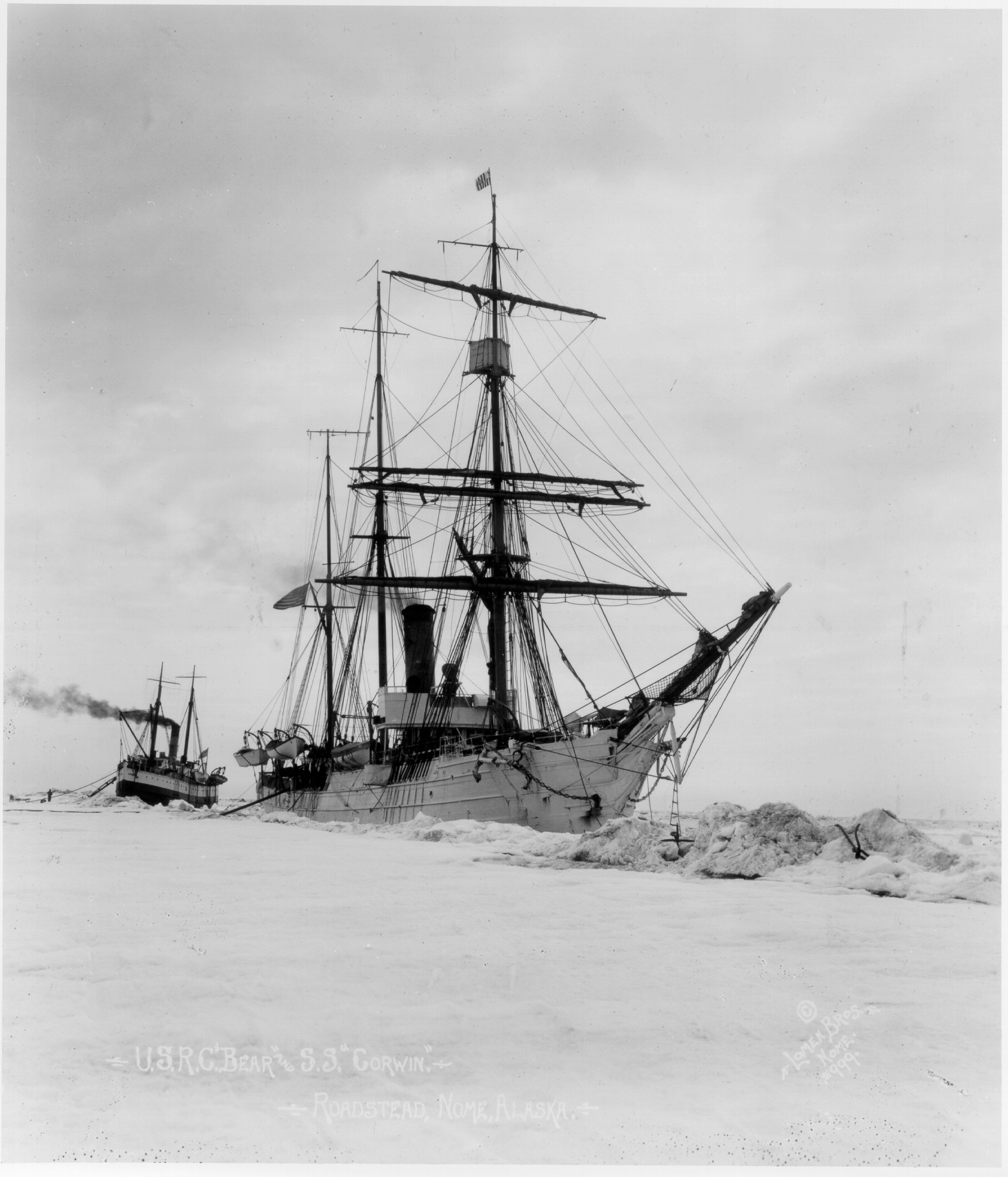 Photograph of Revenue Cutter Bear rescuing a steamer from thick ice off the coast of Alaska. (U.S. Coast Guard)