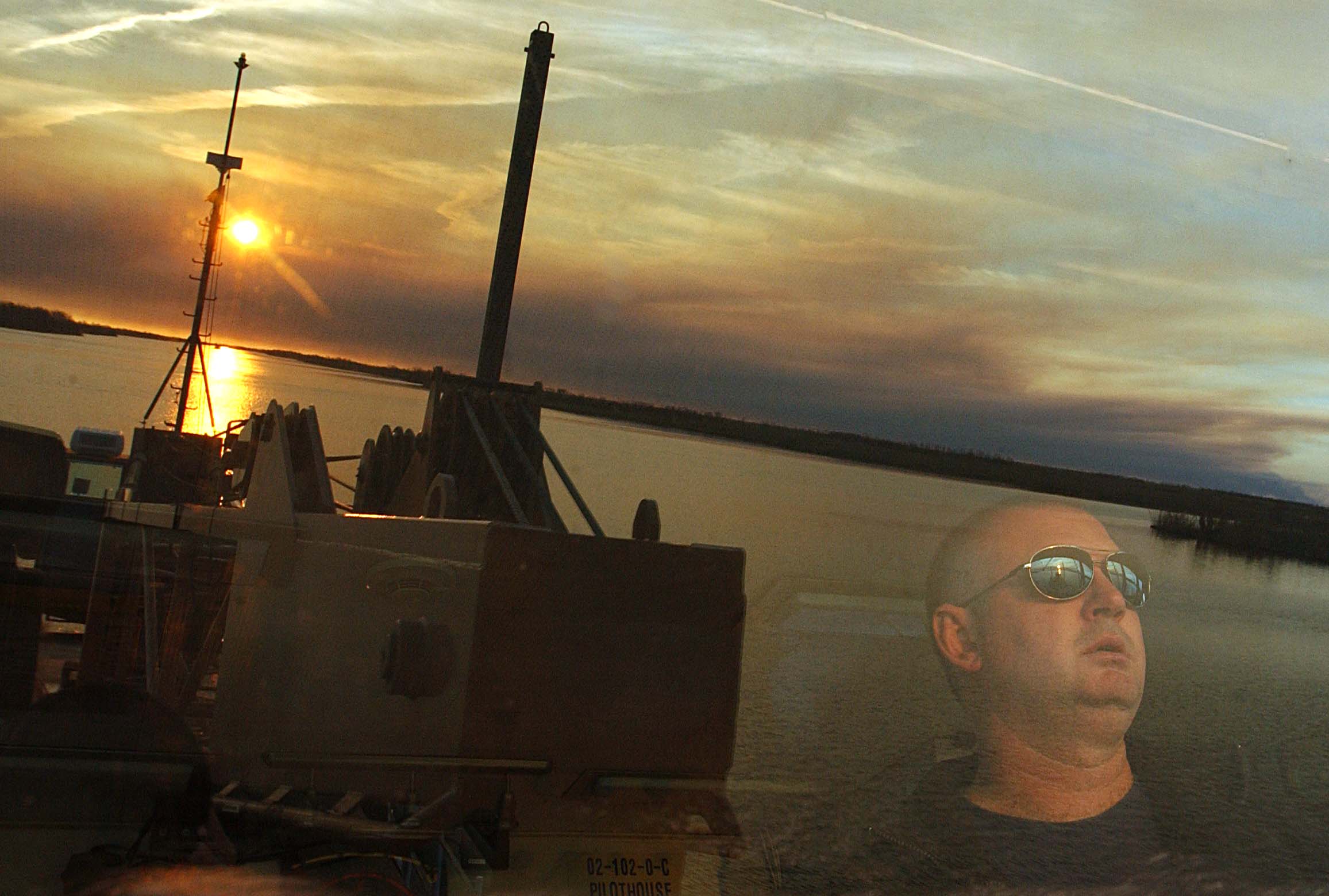 Chief Warrant Officer David Lewald on the bridge of the Pamlico during aids to navigation operations. (U.S. Coast Guard)