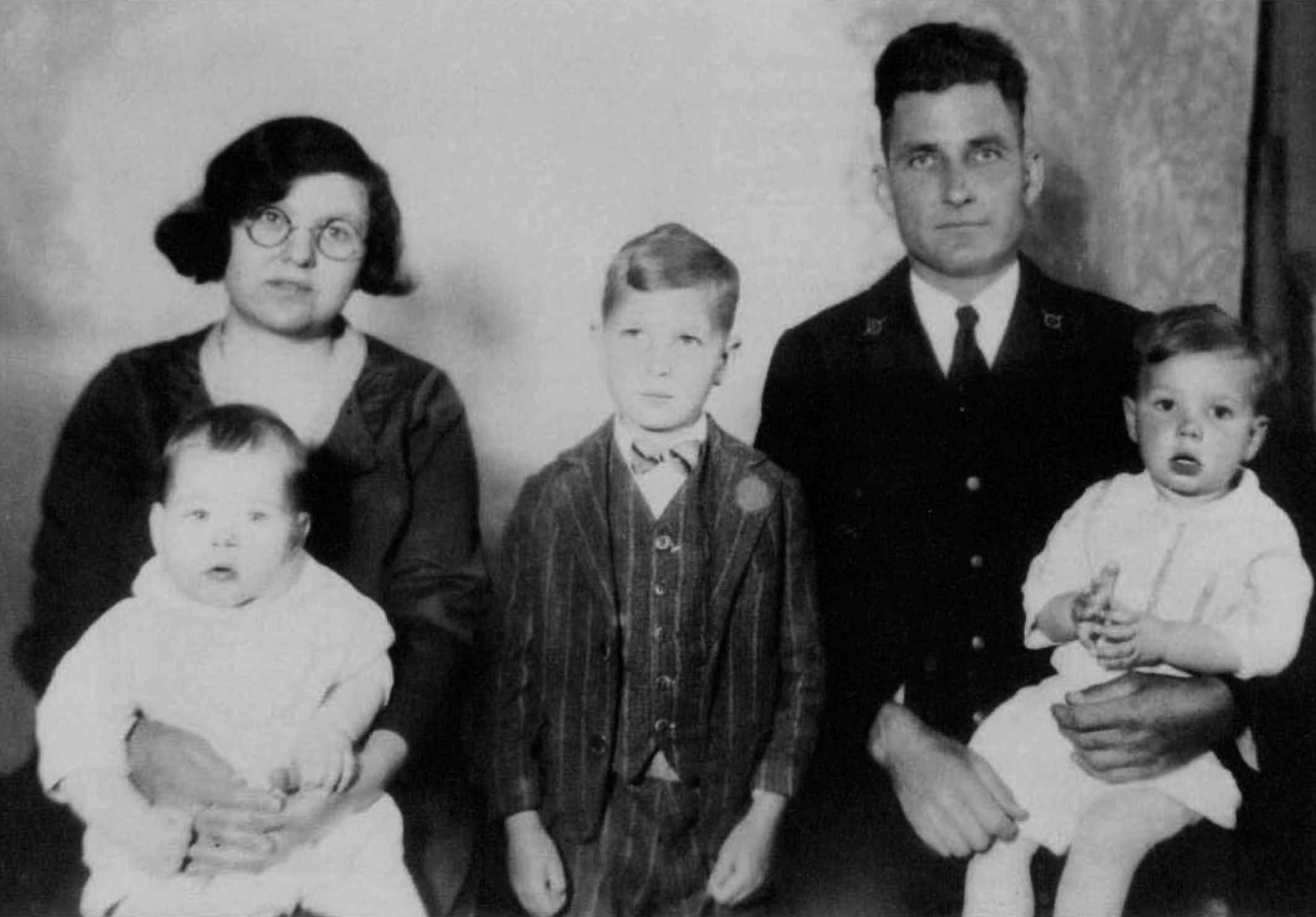 Family photograph of Earl Cunningham in uniform with his family. (Joint Archives of Holland, Michigan)