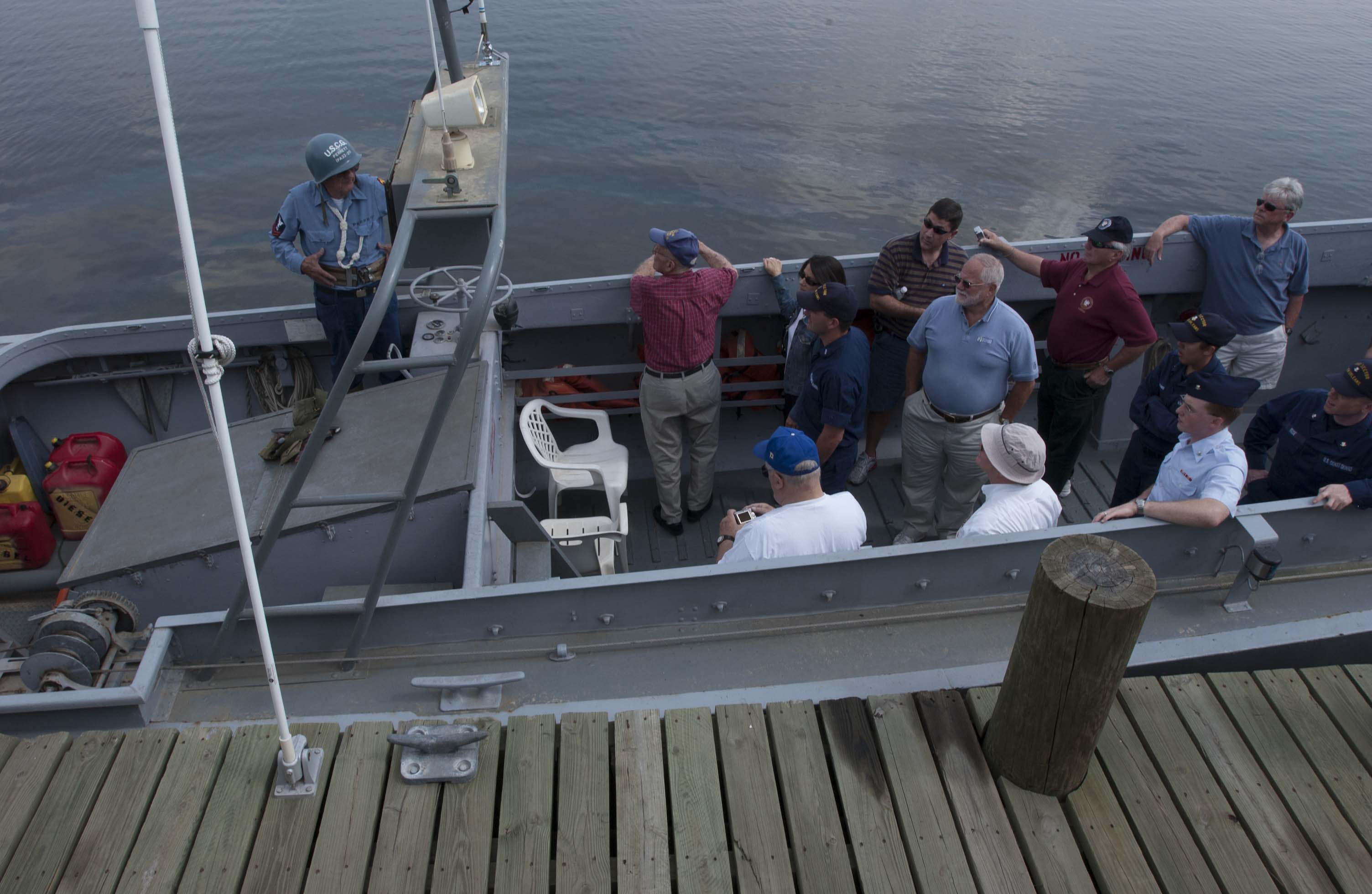 A photograph of Marvin Perrett on board the restored LCVP he operated in New Orleans for many years. (Coast Guard photo by Petty Officer 3rd Class NyxoLyno Cangemi)