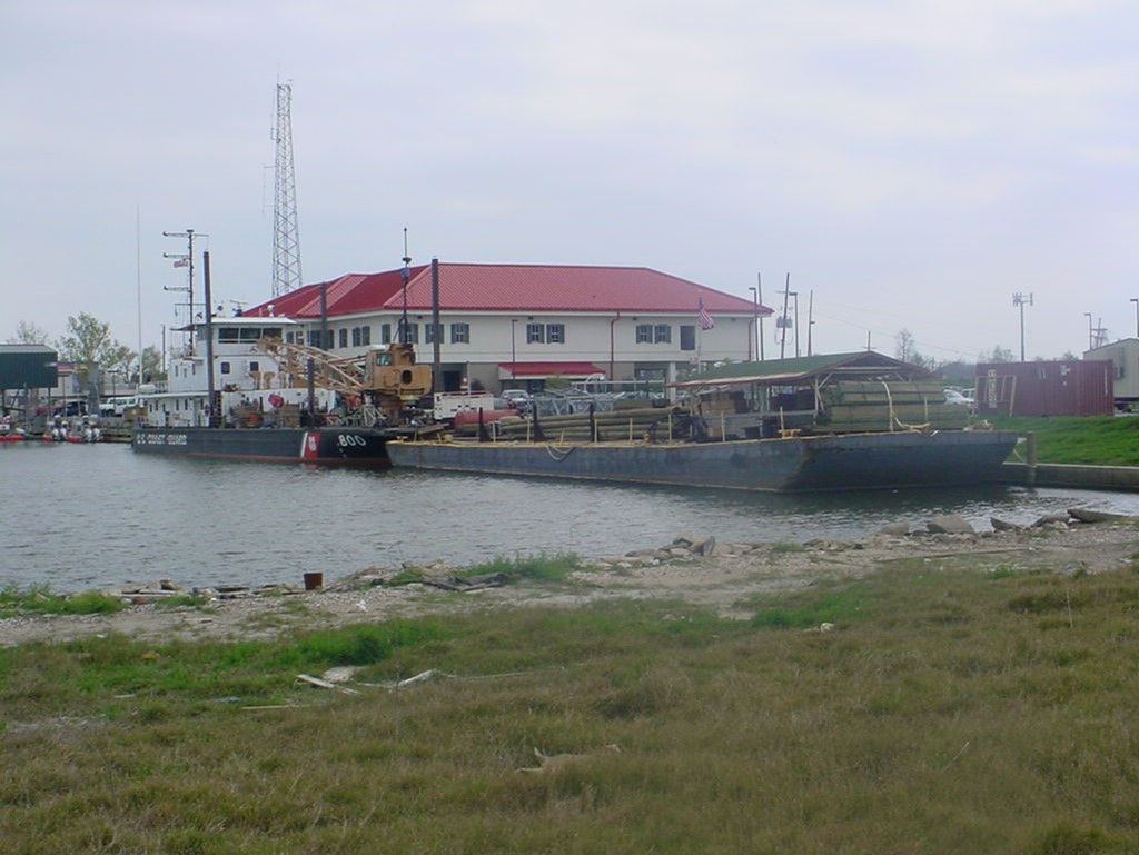 1.	Pamlico with barge full of ATON supplies and construction materials prepares to deploy. (U.S. Coast Guard)