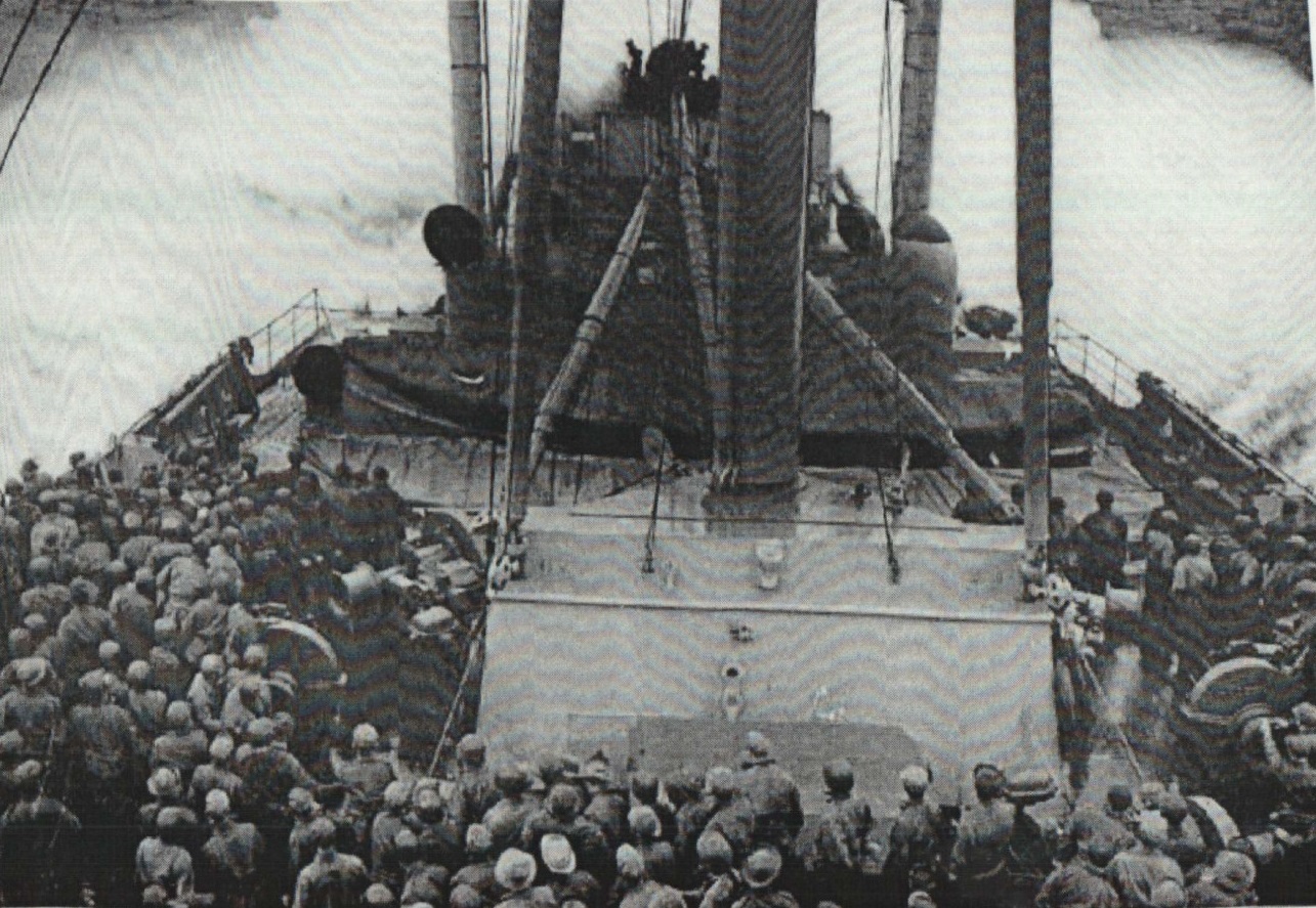 The Wakefield steaming through heavy seas with troops on deck avoiding sea sickness. (U.S. Coast Guard)