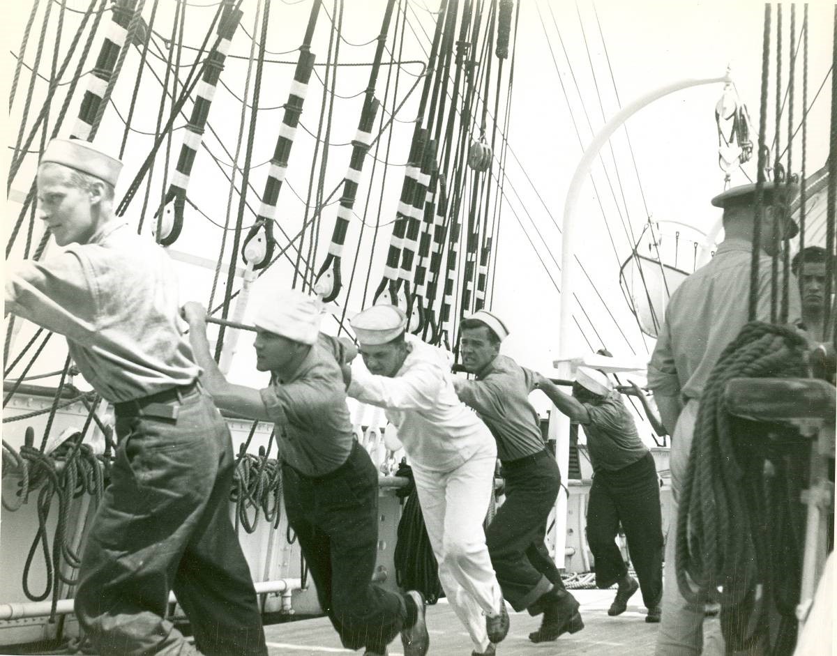 Coast Guard cadets on board the Danmark raising sail. (U.S. Coast Guard)