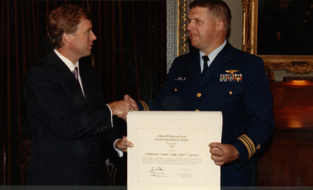 The Harmon Trophy was presented to John Currier at the Old Executive Building across from the White House by Vice President Dan Quayle on June 21, 1991 (11 years after the mission). His name is inscribed on the six-foot trophy encased in a glass enclosure in the National Air and Space Museum. Interestingly, Currier was never notified regarding his selection for the award, which has historically been presented by the President. (U.S. Coast Guard)