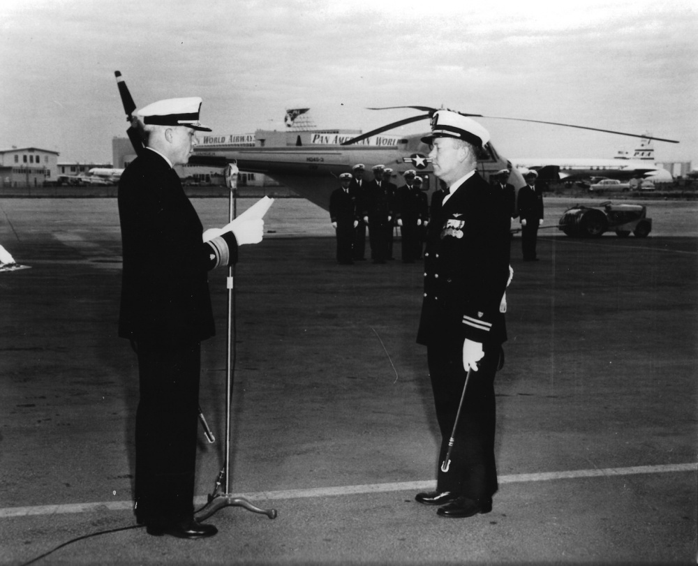 The official award ceremony for Lt. Henry Pfeiffer receiving the Distinguished Flying Cross from Rear Adm. Russell Wood, commander of Coast Guard District 12 and Western Area. (Coast Guard Aviation Association)